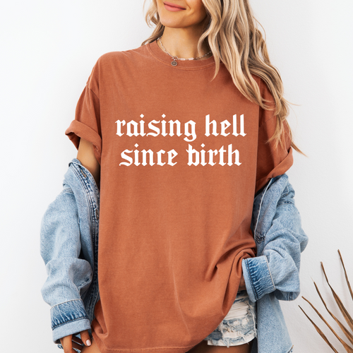 RAISING HELL SINCE BIRTH TEE